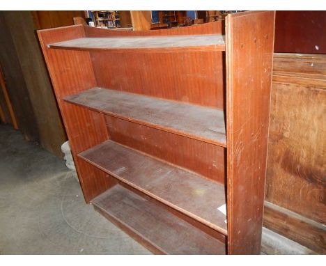 A mahogany veneered 4 shelf open book case.