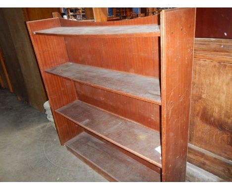 A mahogany veneered 4 shelf open book case.