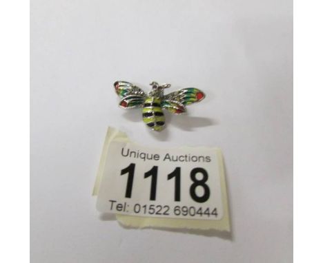A silver marcasite and enamel bee brooch.