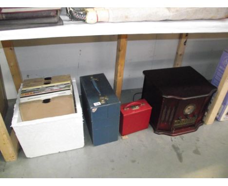 A record player and 2 boxes of records