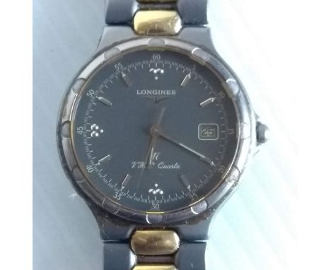 A Longines gent's titanium and gold plated Conquest V.H.P quartz bracelet watch, date aperture and gilt batons with original 