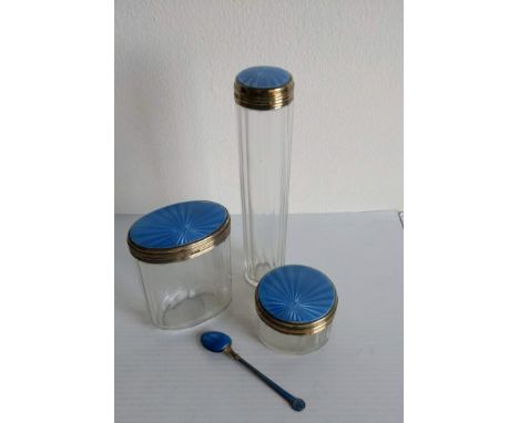 A set of three Art Deco silver-topped vanity jars with blue enamel decoration by Cole Brothers, London, 1930 and a similar co
