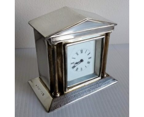 An Edwardian silver-cased mantle clock of architectural form, French mechanism, with dedication, by Henry Matthews, Birmingha