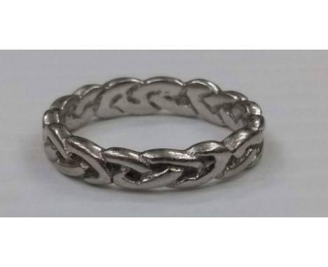 A contemporary Celtic-knot design ladies ring, size N, tests for platinum, 6g