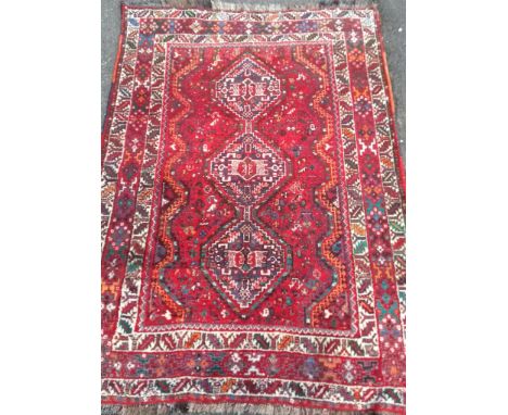 A hand-knotted Baluch wool rug with double border, short fringe, in good condition, light wear, 175 x 116 cm 