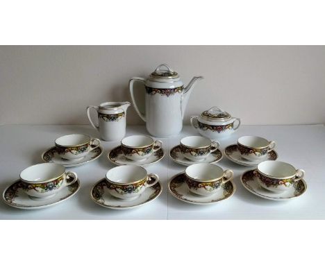 An early 20th century KPM Germany coffee service comprising 8-cups/saucers, coffee pot, lidded bowl and jug with a set of fiv