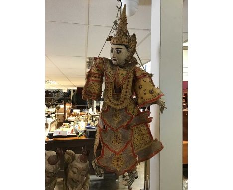 Indonesian puppet with carved wooden head