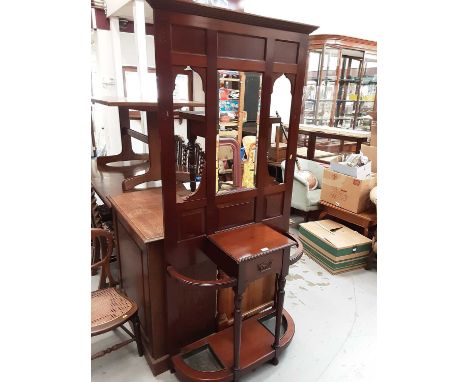 Early 20th century mahogany hall stand with bevelled mirror back, central drawer and two umbrella/stick trays below 191cm hig