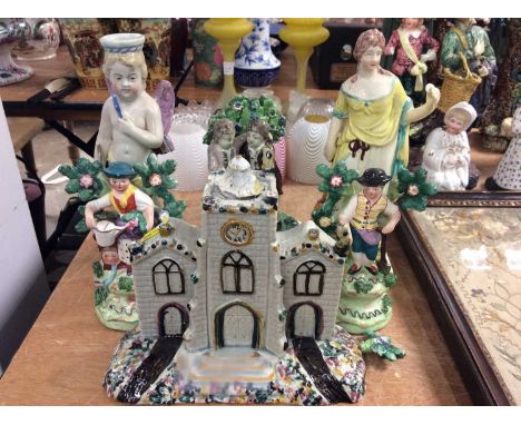Group early 19th century Staffordshire figures to include Pearlware cherub candlestick, figure of a woman, couple dancing, pa