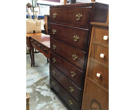 Oak tall boy chest with six drawers and brass handles on bracket feet 77cm wide, 139 cm high