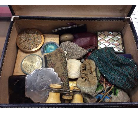 Vintage suitcase containing two beaded purses, powder compacts, pair opera glasses and other accessories