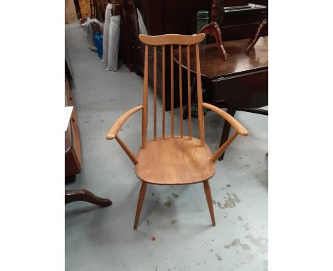 Two Ercol light elm stick back chairs