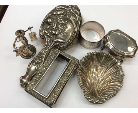 Group silver and white items to include silver backed brush, match box holder, shell shaped dish, napkin ring, together with 