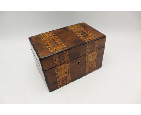 A 19th century Tunbridge ware walnut tea caddy, the lid and front decorated with two geometric bands enclosing twin lidded co