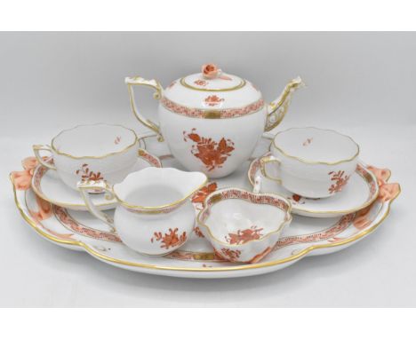 A Herend Apponyi orange design cabaret tea set painted with orange Chinese bouquet and gilded highlights consisting of a tray