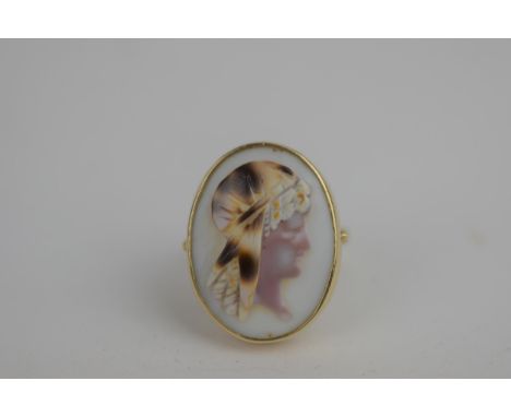 An oval cameo ring in a 9ct gold setting, depicting a 1920's female wearing a head scarf, total weight, 4.97gLocation: 