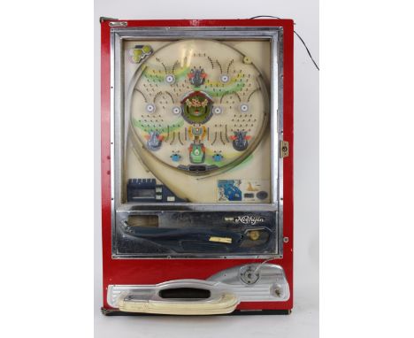 A vintage Nishijin Japanese pachinko gaming slit machine with a repainted red case, 81cm high, 51.5cm wide, with a collection