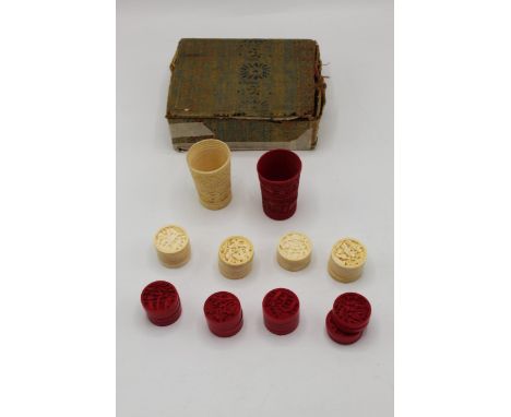 A Chinese, late 19th century Canton ivory backgammon set comprising sixteen stained and sixteen natural counters and two dice