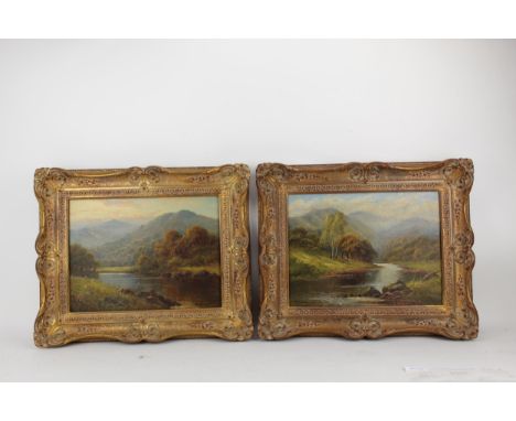 H K Foster - a pair of river scenes with trees, rocks and hills beyond, oil on canvas, signed LR and LL, 30cm x 41cm, in gilt