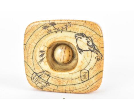 A Japanese Edo period 18th/19th century, netsuke style ivory frog weight, with a metal ring, attached to a button, the unders