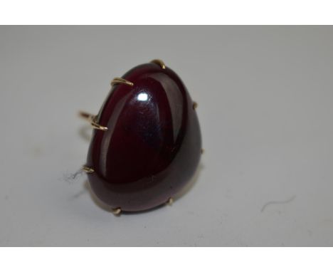 A kidney shaped stone ring set in a 9ct gold claw setting, total weight 10.10gLocation: 