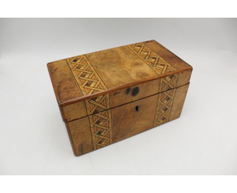 A 19th century Tunbridge ware walnut tea caddy, the lid and front decorated with two geometric bands, enclosing twin lidded c