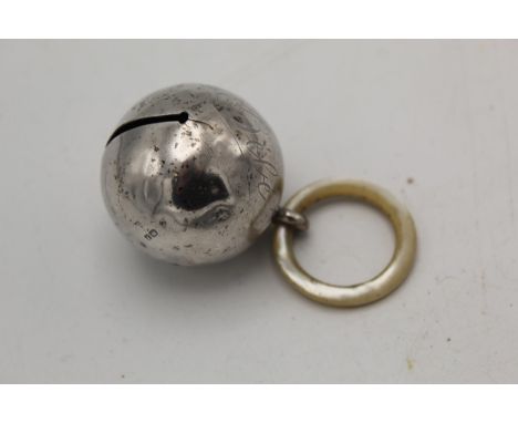 An Edwardian silver babies rattle by S Blanckensee &amp; Son Ltd Chester 1909 of bulbous bell design, with a mother of pearl 