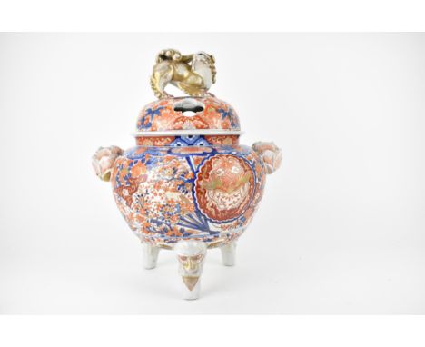 A Japanese Meiji/Taisho period Imari incense burner of bulbous shape, the cover with pierced ornament, lion dog finial and fl