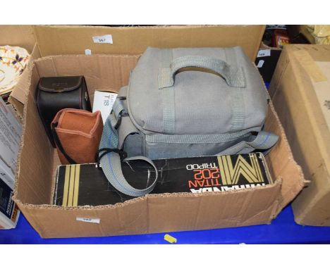 An Olympus camera plus various others and accessories