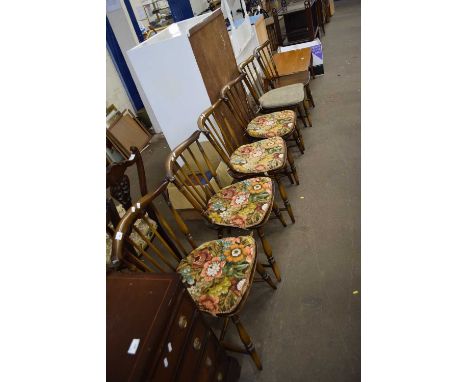 A set of six Ercol dark elm stick back chairs