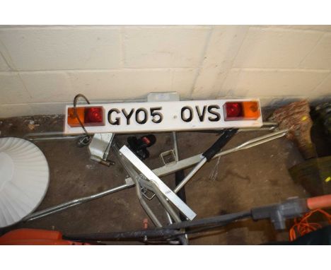 A bike transport tow bar together with a trailer light board