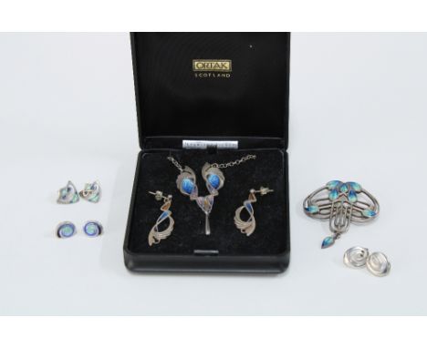 A collection of Art Nouveau inspired silver and enamel jewellery to include a brooch, pendant necklace and four pairs of earr