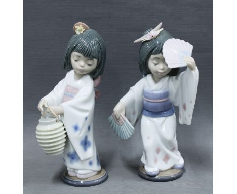 Two Lladro Japanese girl figures, one with a lantern and the other with two fans, No. 6230 &amp; 6231, 19cm (2) 