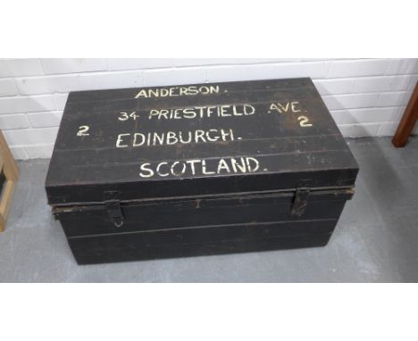 Vintage black painted metal trunk, labelled Anderson,  Edinburgh, Scotland, with red interior. 37 x 84 x 46cm 