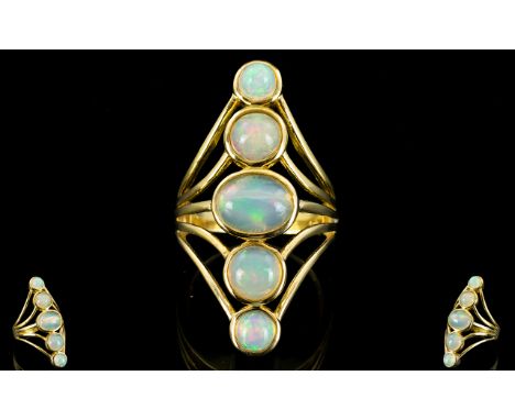 Opal Kite Shape Statement Ring, five bezel set opals, the largest to the centre being a 1.5ct oval cut, with two graduated ro