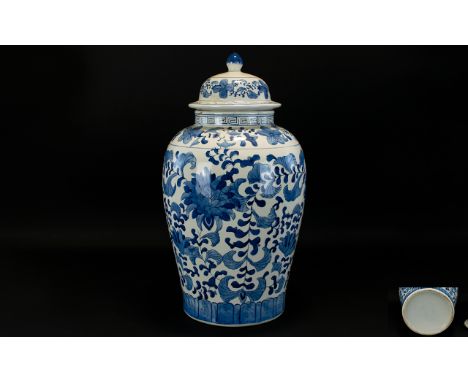 Chinese - Early to Mid 20th Century Large Ceramic Blue and White Vase, Decorated with Floral Images on White Ground. Stands 1