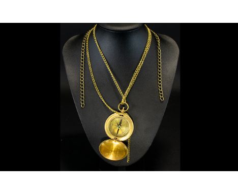 A Modern Brass Compass Complete with chain, aged patina. Please see accompanying image