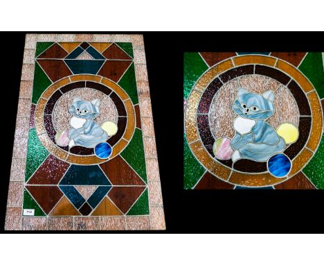 Large Leaded And Stained Glass Panel Rectangular panel in green, blue, red and clear glass with central kitten motif. Loose p