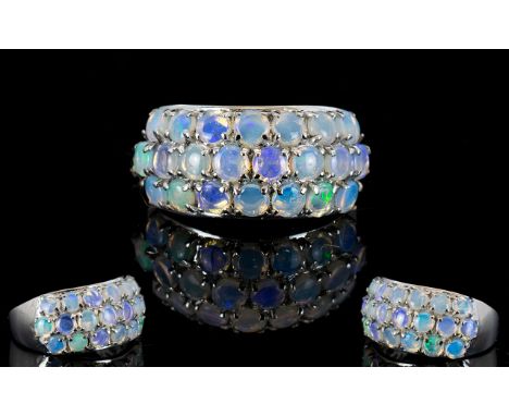 Australian Coober Pedy Opal Band Ring, three rows of closely set, round cut, Australian opals totalling 1.5cts, in platinum v