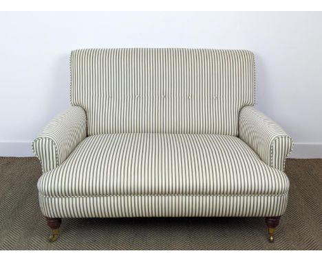 SOFA, green ticking upholstered with brass front castors, 81cm H x 125cm W. 