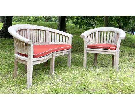 GARDEN BANANA BENCH, nicely weathered high grade slatted teak with arched bow back together with the matching armchair all wi