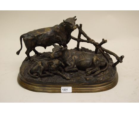 After Moigniez, a mid to late 20th Century patinated bronze group of a bull, cow and calf, 15ins wide 