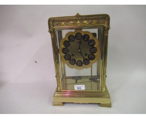 French gilt brass four glass library clock, the circular black enamel and gilded dial with two train movement striking on a g