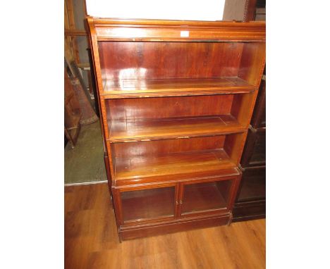 Pair of early 20th Century mahogany and satinwood crossbanded sectional bookcases, each with three open shelves above a pair 