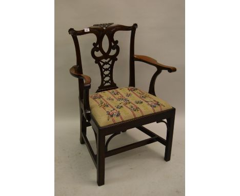 Pair of 19th Century mahogany open armchairs in Chippendale style, the carved and pierced splat backs above needlepoint seats