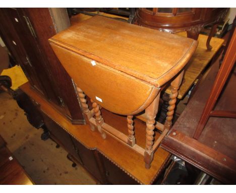 Small 1930's oval oak gate leg table on barley twist supports 