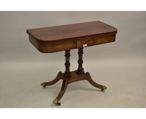 Regency mahogany and black line inlaid D-shaped fold-over card table on a twin turned column support and quadruped base with 