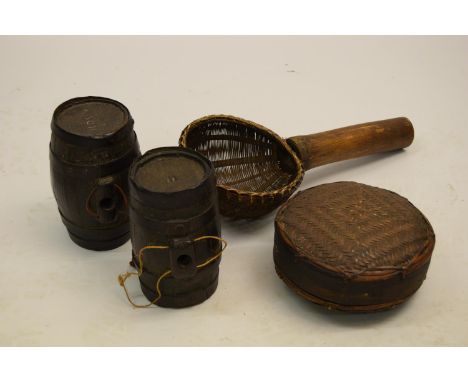 Two small antique oak and iron bound spirit barrels, together with a Japanese circular bamboo container and a similar ladle 