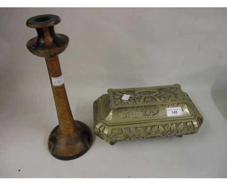 Rectangular metal sarcophagus shaped casket with floral pierced decoration, together with a Winckley ware turned wooden candl