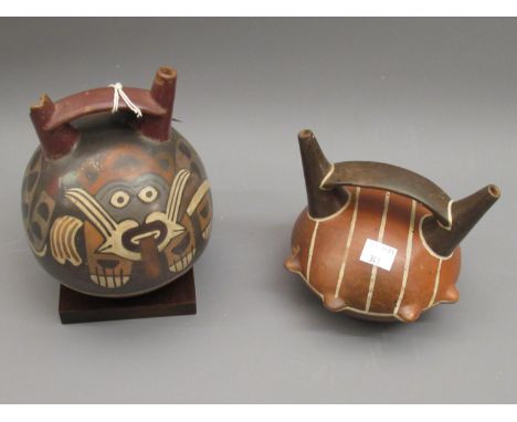 Nazca type twin spouted pottery flask with painted stylised animal decoration, 6ins tall (damages), together with another sim